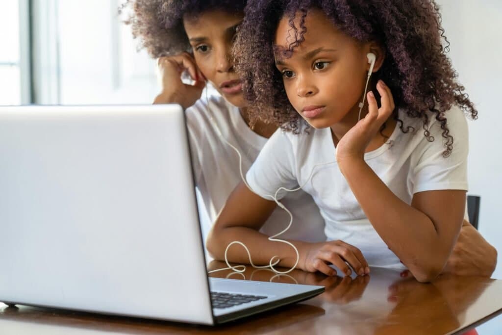 A mother and daughter experiencing the benefits of homeschooling in South Africa by learning together at home